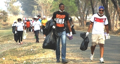 Sean Innoscent Ukomba of Climate Impact Faith Alliance in an adopt a neighbourhood clean-up