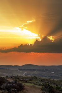 The sun sets over Grahamstown as a storm blows in from the horizn, as seen from the Toposcope, Sunday 17 August 2014. (Louisa Feiter)